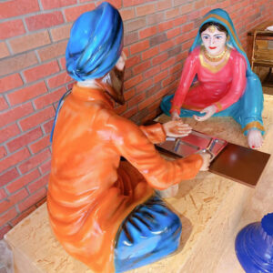 Punjabi Couple Sitting On Manja At Dhaba Fiber Statue Image
